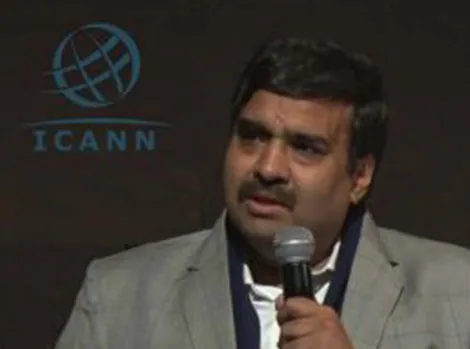 Dr. Ajay Data speaking on stage at an ICANN event